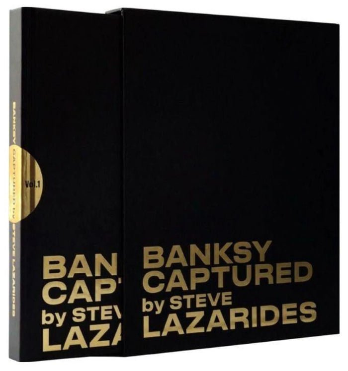Book by Steve Lazarides titled Captured. This photo contains the book which black and the title Banksy Captured by Steve Lazarides in Gold . The book is from an ediion of 1000