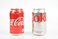 Damien Hirst, Pair of signed Coca-Cola cans, 2021