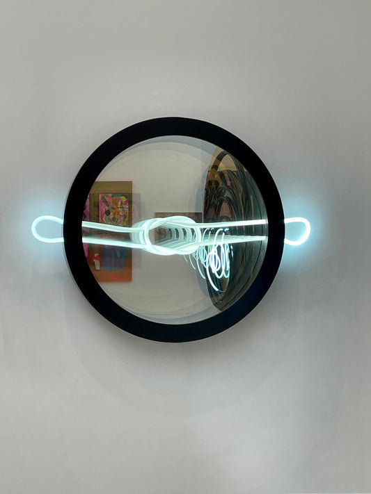 Mark Beattie's Infinity Love Knot – a luminous masterpiece blending LED light, two-way mirror, and aluminum frame (80 x 95 x 10 cm). Symbolizing eternal love, available in pink, red, and blue. Elevate your space with this captivating contemporary artwork.