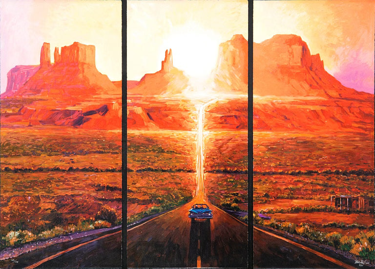 A three-panel canvas wall art print depicting a desert landscape at sunset with red rock buttes, a glowing sun, and a road leading toward the horizon. The artwork fills the entire frame.