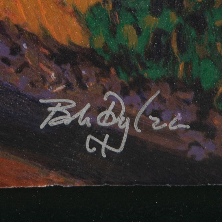 Close-up of a painted artwork showing textured brushstrokes in orange, green, black, and purple, with Bob Dylan's white handwritten signature across the centre of the artwork .