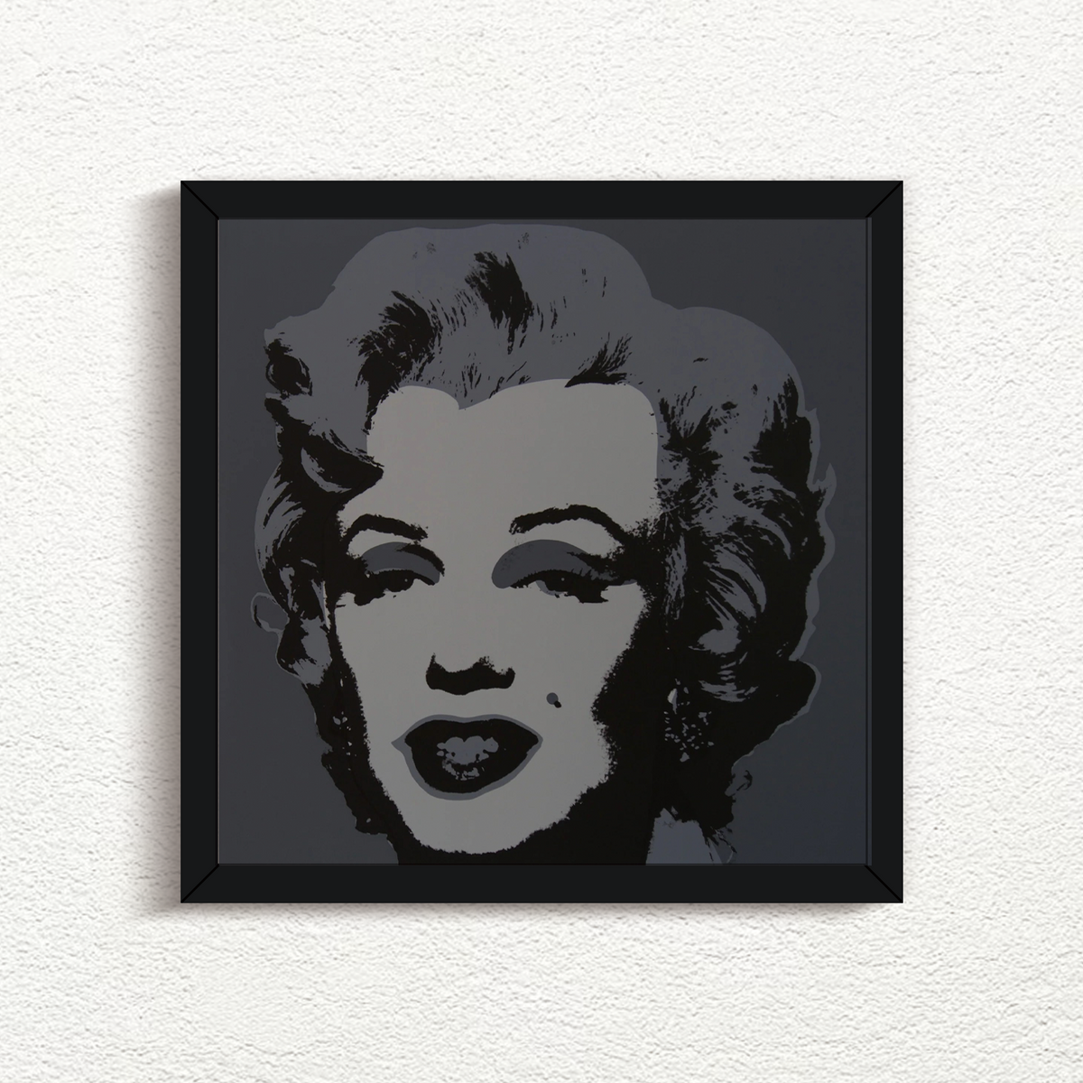 this is an image of a print by sunday b morning after andy warhol titled 'marilyn 11:24' in black frame. this artwork features a screenprint of marilyn monroe in greyscale. this is a sunday b morning print for sale.