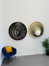 Add a touch of brilliance to your space with Mark Beattie's White Neon in Black Spiral, a unique sculpture featuring white neon and painted copper on gold mirror acrylic. This one-of-a-kind masterpiece, with a diameter of 120cm, creates a captivating interplay of light, texture, and contemporary design. Illuminate your surroundings with the artistic brilliance of White Neon in Black Spiral, a unique addition to any collection.