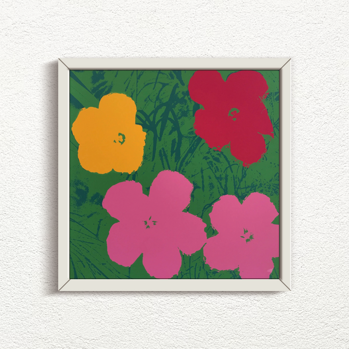 image of a sunday b morning print after andy warhol titled 'flowers 11:68' in a white frame. the artwork is the famous andy warhol flowers in a green, red, yellow, and pink colourway. this is a sunday b morning print