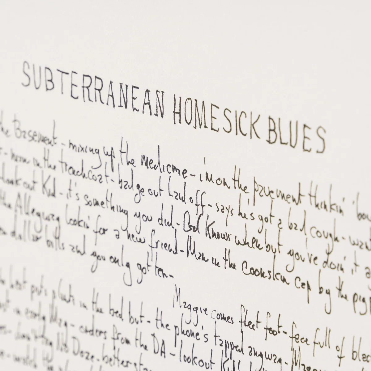 A close-up of handwritten text on a white sheet of paper, with the title 'SUBTERRANEAN HOMESICK BLUES' written in large capitalised letters at the top. Bob Dylan lyrics For Sale
