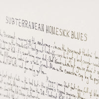 A close-up of handwritten text on a white sheet of paper, with the title 'SUBTERRANEAN HOMESICK BLUES' written in large capitalised letters at the top. Bob Dylan lyrics For Sale
