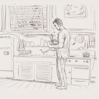 A monochrome pencil-style sketch of a man standing in a kitchen and holding a bowl, with kitchen cabinets, stove, utensils, and window details drawn around him. Sill life scene by the artist Bob Dylan