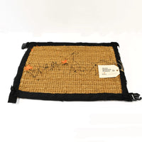 Buy Banksy merchandise online, Banksy for sale, Banksy Welcome Mat 2019, Banksy GDP 2019, Banksy Gross Domestic Product. Image is of a welcome mat, which is brown, stating 'welcome' in cursive writing. The item is distinctively rugged and rustic looking, with zips and safety belt buckles sticking out