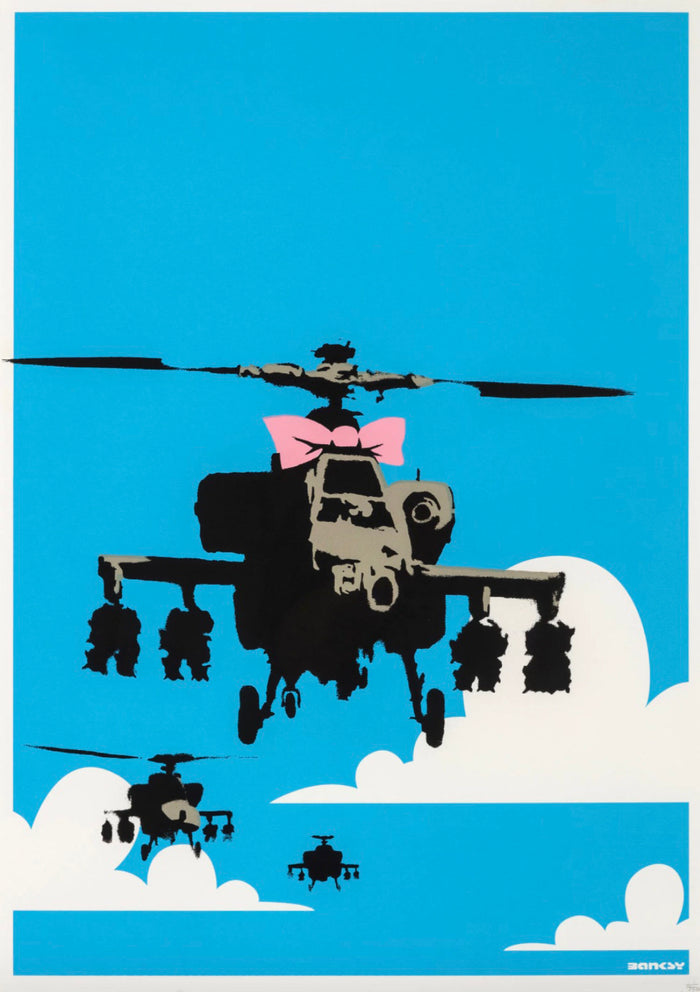 This image depicts artwork from Banksy titled Happy Chopper which has 3 helicopters on a blue and white background with one of the helicopters having a pink bow which makes it look like a gift is arriving