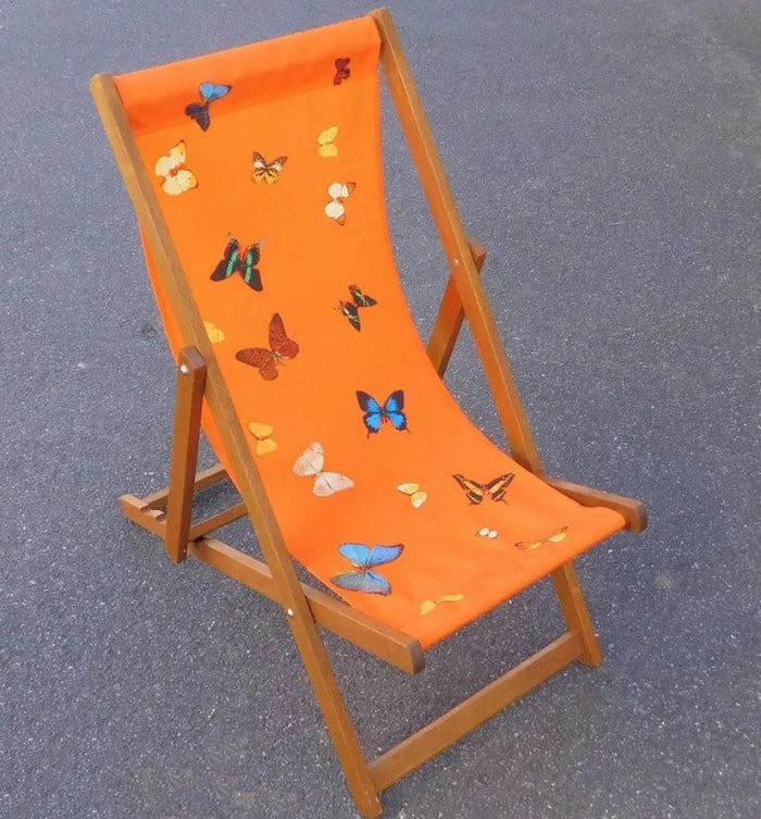 Damien Hirst Orange Deck Chair Apart from their rich association with childhood, butterflies are symbols of freedom and thus represent escape; death (something of an obsession for Hirst) is the ultimate release. Each chair bears an aluminium plaque screwed to the frame, with Damien Hirst facsimile signature and trademarks and with just 250 in the limited edition, these deckchairs are extremely difficult to come by.