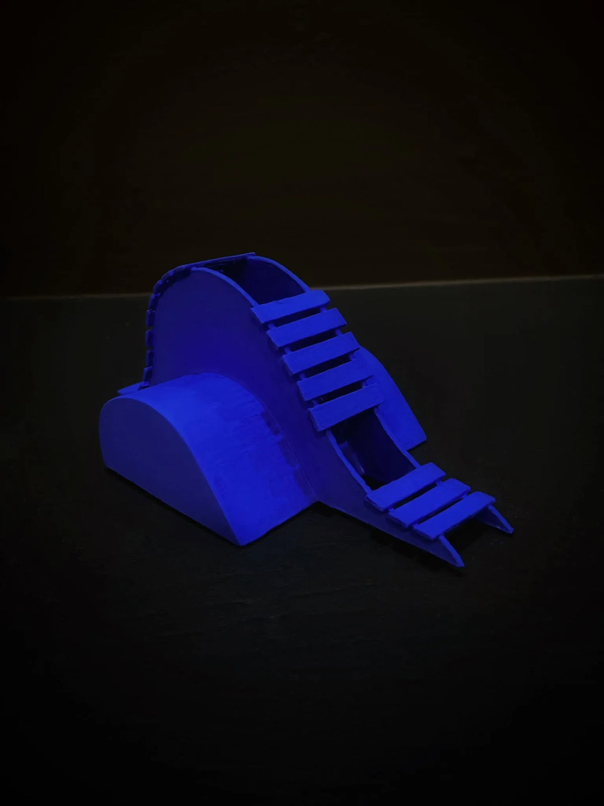 Close-up view of Naomi Harwin's 'Dwelling II, 2023' – a cobalt blue sculpture intricately composed of greyboard, jesmonite, emulsion paint, and varnish. Experience the tactile details of this 20cm x 10cm x 10cm artwork, revealing the artist's meticulous craftsmanship and unique artistic vision