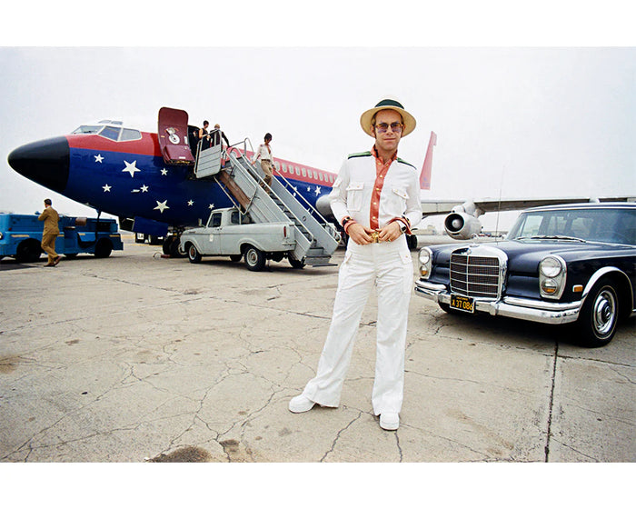 Terry O'Neill, Elton John with his private plane, 1974 Limited edition fine art photograph by Terry O'Neill, featuring iconic portrait photography of celebrities and cultural figures. Available for sale at Smolensky Gallery