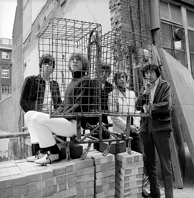 Gered Mankowitz, The Rolling Stones photographed behind a cage in Ormond Yard, London, 1965 Limited edition fine art photograph by Gered Mankowitz, capturing iconic portraits of legendary musicians and cultural icons. Available at Smolensky Gallery