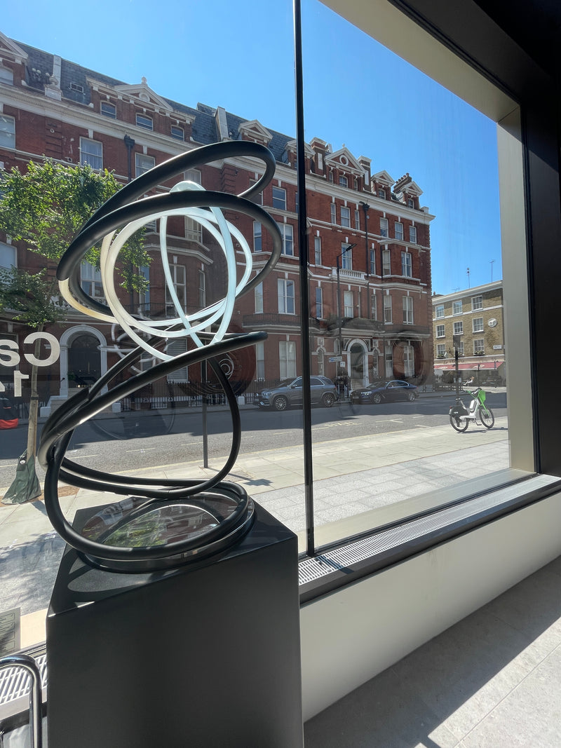 Mark Beattie Tall Neon Spiral - Unique White Neon Sculpture on Copper and Stainless Steel Plinth for Outdoor Display