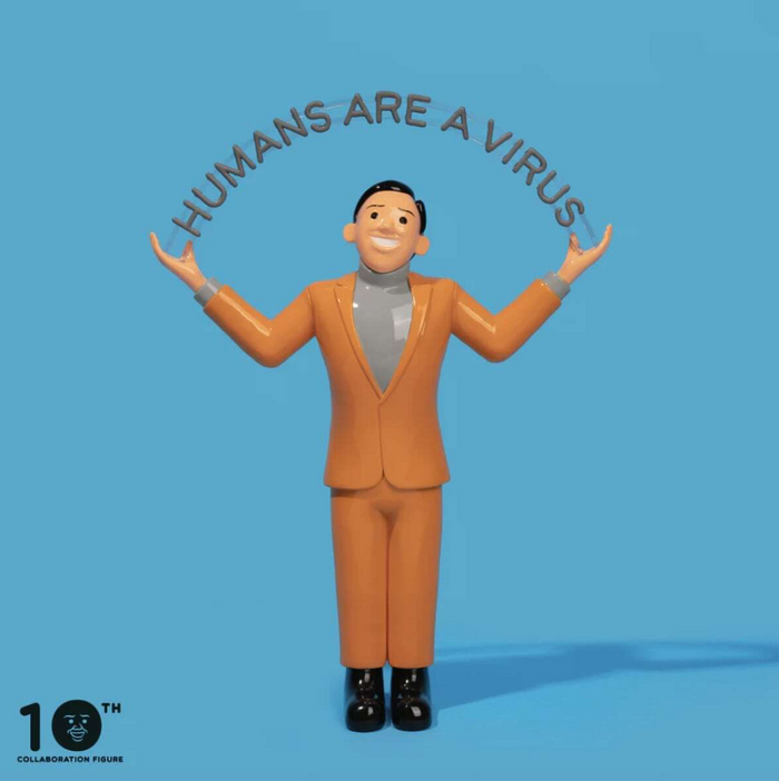 A 10th Anniversary collaboration figure of a man in an orange suit and gray turtleneck with arms outstretched, under the text 'HUMANS ARE A VIRUS' on a solid blue background.