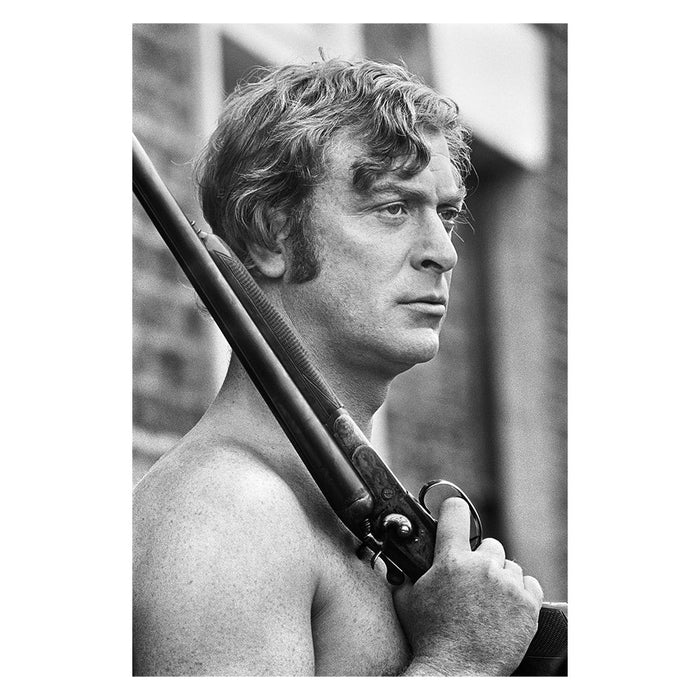Terry O'Neill, Michael Caine holding a rifle, 1970