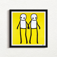 STIK_Holding_Hands_Signed_Yellow_2020_with black frame print for sale from Smolensky Gallery