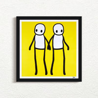 STIK_Holding_Hands_Signed_Yellow_2020_with black frame print for sale from Smolensky Gallery