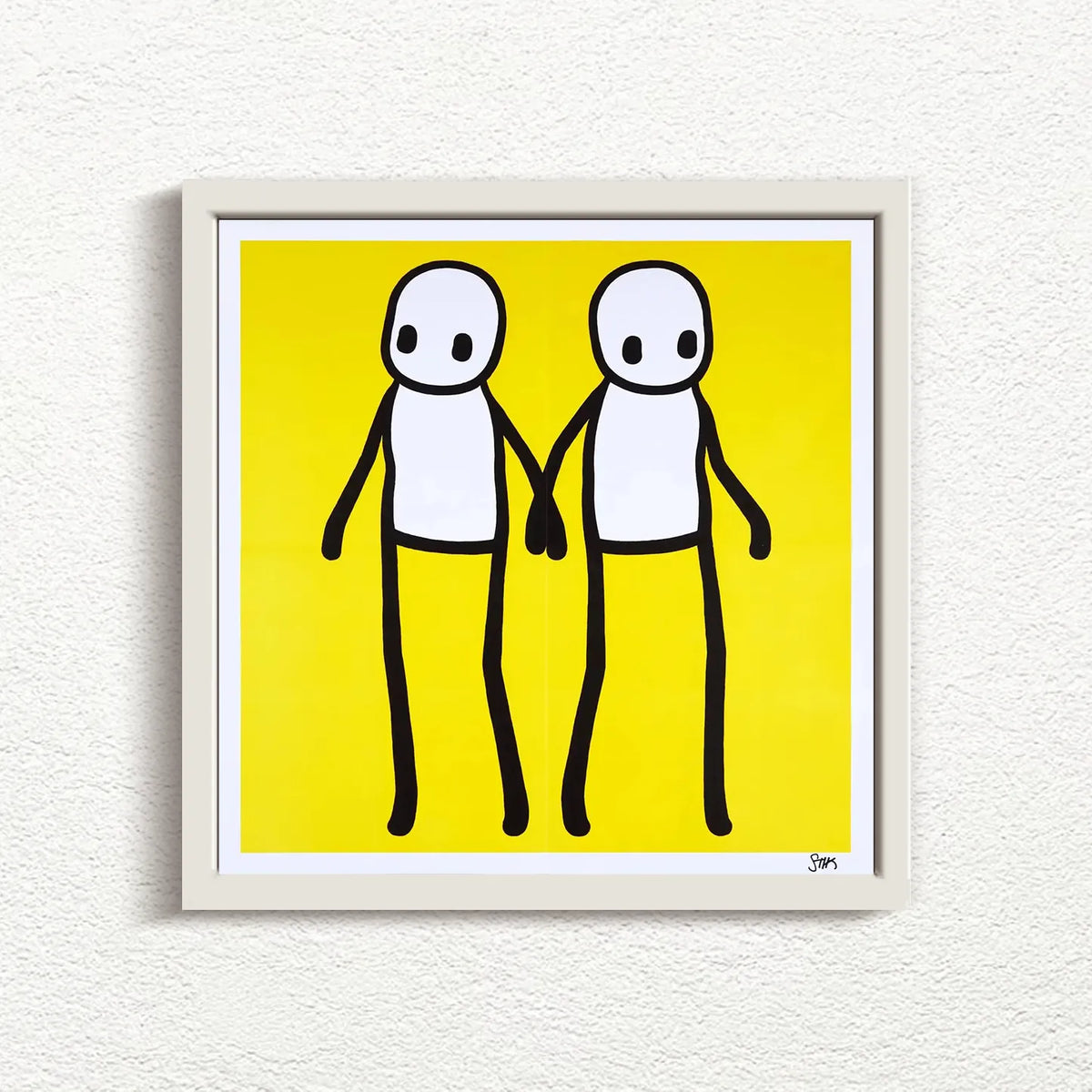 STIK_Holding_Hands_Signed_Yellow_2020_with white frame print for sale from Smolensky Gallery
