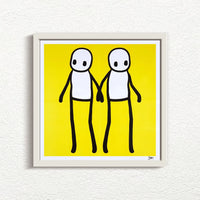 STIK_Holding_Hands_Signed_Yellow_2020_with white frame print for sale from Smolensky Gallery