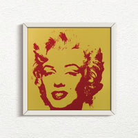 this is a sunday b morning print after andy warhol titled 'golden marilyn 40' in a white frame. the artwork features a red screenprint of marilyn monroe's face on a golden background. this is a sunday b morning print for sale