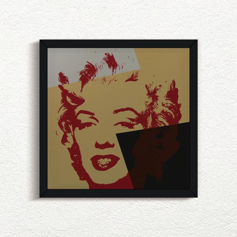 an image of an artwork by andy warhol titled 'golden marilyn 44' in black frame. the artwork features a stencilled print of the face of marilyn monroe, printed in red over a background of gold, black, and white. this is a sunday b morning print for sale.