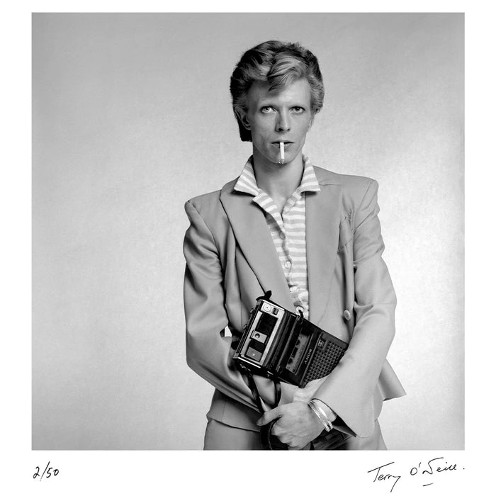 Terry O'Neill, David Bowie holding a cassette player, 1974 Limited edition fine art photograph by Terry O'Neill, featuring iconic portrait photography of celebrities and cultural figures. Available for sale at Smolensky Gallery