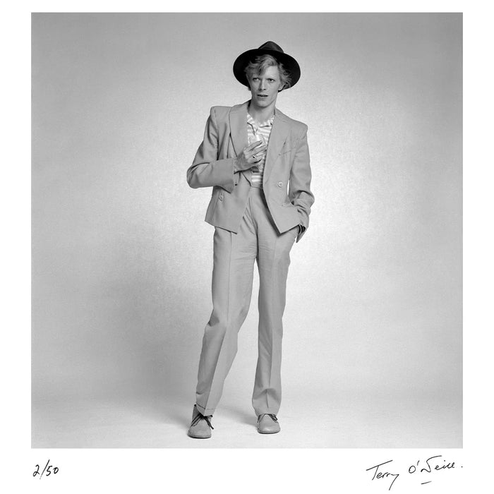 Terry O'Neill, David Bowie holding a glass, 1974 Limited edition fine art photograph by Terry O'Neill, featuring iconic portrait photography of celebrities and cultural figures. Available for sale at Smolensky Gallery