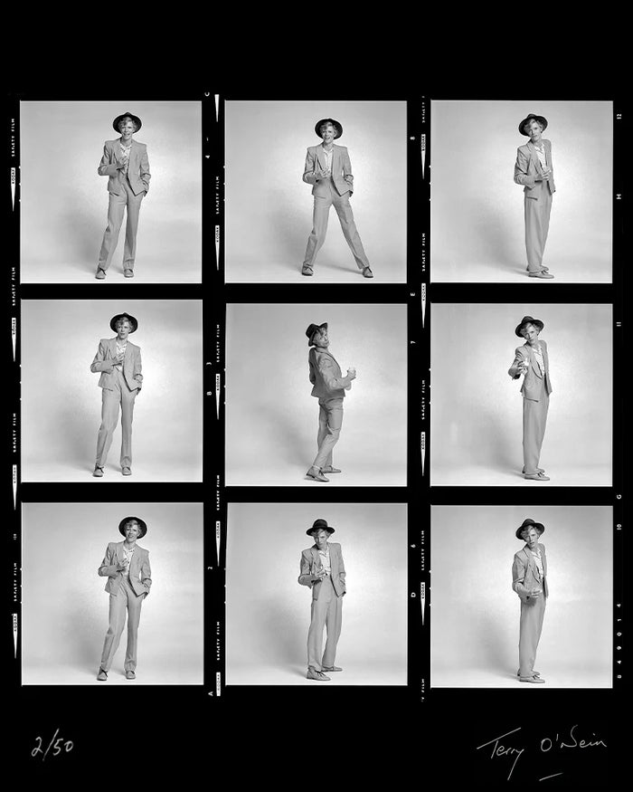 Terry O'Neill, David Bowie holding a glass contact sheet, 1974 Limited edition fine art photograph by Terry O'Neill, featuring iconic portrait photography of celebrities and cultural figures. Available for sale at Smolensky Gallery