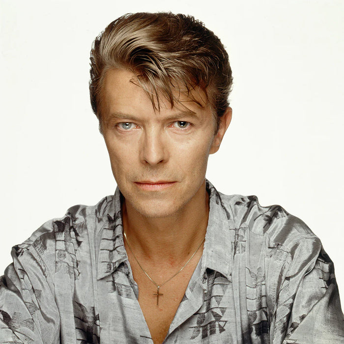 Terry O'Neill, David Bowie wearing a cross, 1992 Limited edition fine art photograph by Terry O'Neill, featuring iconic portrait photography of celebrities and cultural figures. Available for sale at Smolensky Gallery