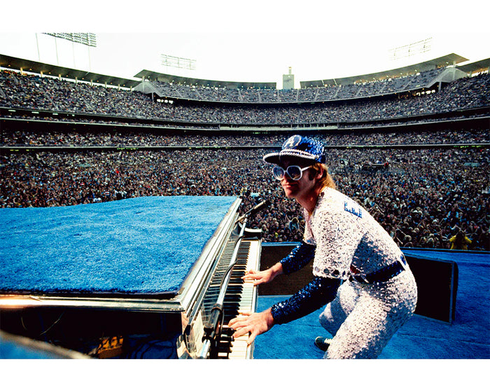 Terry O'Neill, Elton John at Dodger Stadium, 1975 Limited edition fine art photograph by Terry O'Neill, featuring iconic portrait photography of celebrities and cultural figures. Available for sale at Smolensky Gallery
