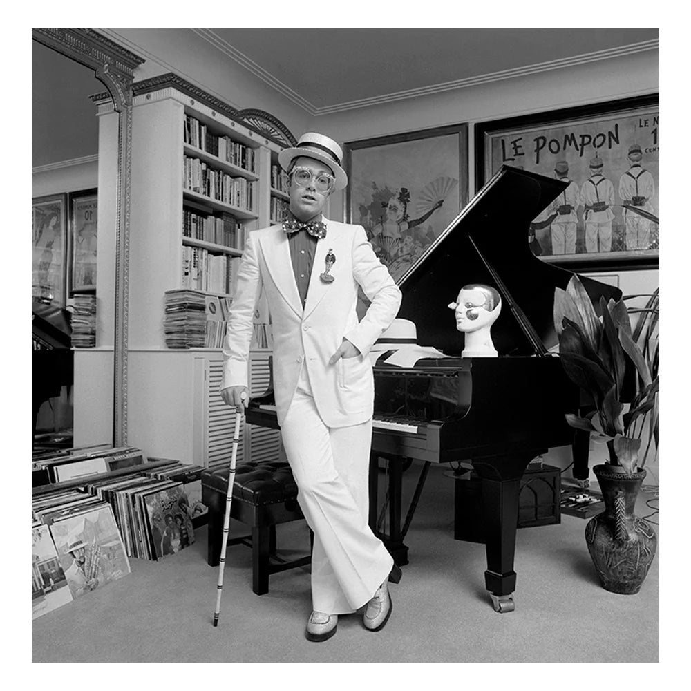 Terry O'Neill, Elton John standing at his piano, 1974 Limited edition fine art photograph by Terry O'Neill, featuring iconic portrait photography of celebrities and cultural figures. Available for sale at Smolensky Gallery