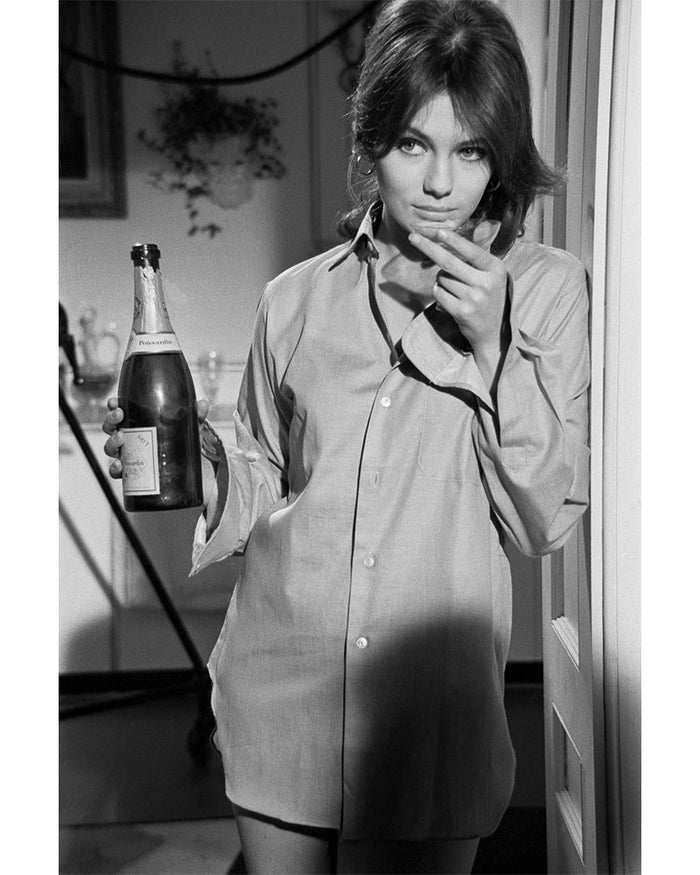 Terry O'Neill, Jacqueline Bisset drinking champagne, 1967 Limited edition fine art photograph by Terry O'Neill, featuring iconic portrait photography of celebrities and cultural figures. Available for sale at Smolensky Gallery