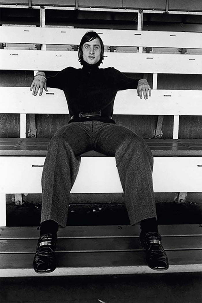 Terry O'Neill, Johan Cruyff sitting in the stands, mid 1970s Limited edition fine art photograph by Terry O'Neill, featuring iconic portrait photography of celebrities and cultural figures. Available for sale at Smolensky Gallery