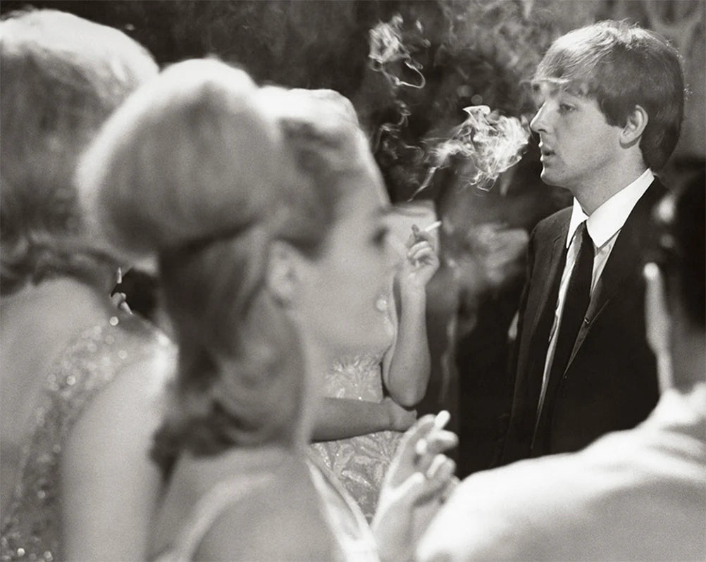 Terry O'Neill, Paul McCartney at a London party, 1964 Limited edition fine art photograph by Terry O'Neill, featuring iconic portrait photography of celebrities and cultural figures. Available for sale at Smolensky Gallery