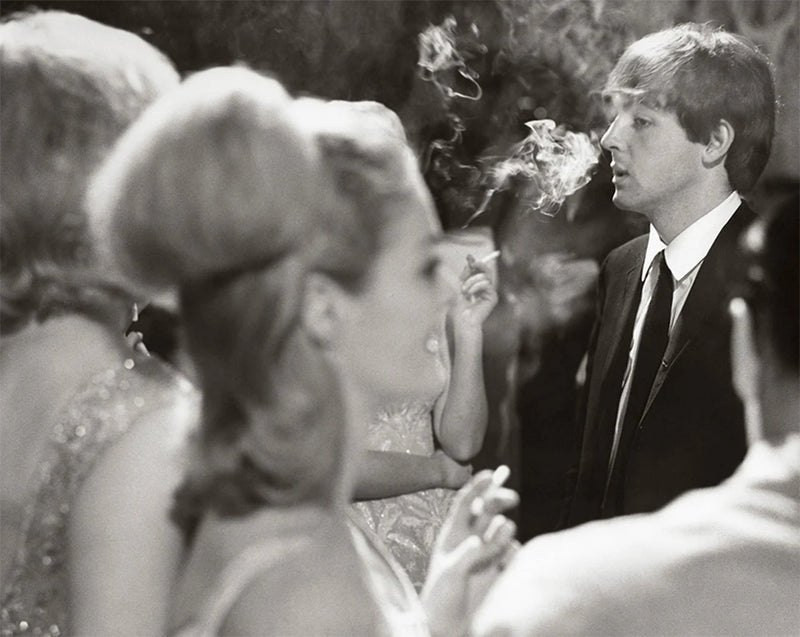 Terry O'Neill, Paul McCartney at a London party, 1964 Limited edition fine art photograph by Terry O'Neill, featuring iconic portrait photography of celebrities and cultural figures. Available for sale at Smolensky Gallery