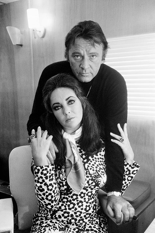 Terry O'Neill, Richard Burton & Elizabeth Taylor in Hounslow, 1971 Limited edition fine art photograph by Terry O'Neill, featuring iconic portrait photography of celebrities and cultural figures. Available for sale at Smolensky Gallery