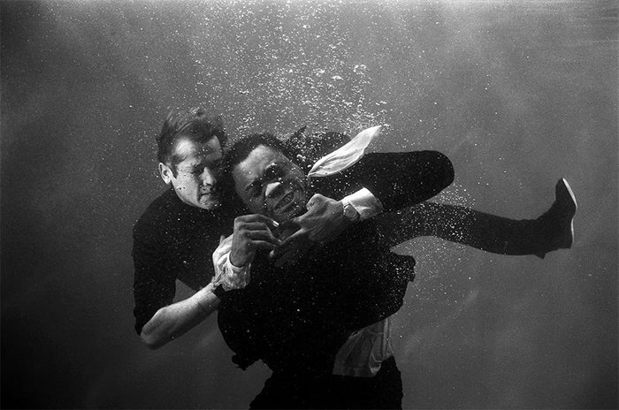 Terry O'Neill, Roger Moore as James Bond underwater on the film set of 'Live and let die', 1973 Limited edition fine art photograph by Terry O'Neill, featuring iconic portrait photography of celebrities and cultural figures. Available for sale at Smolensky Gallery