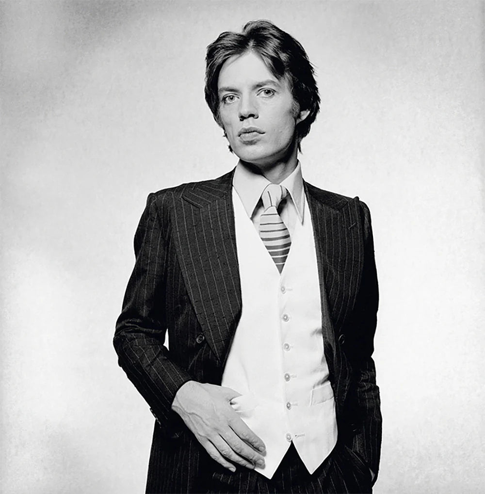 Terry O'Neill, Rolling Stones singer Mick Jagger dressed in a pinstripe suit, 1976 Limited edition fine art photograph by Terry O'Neill, featuring iconic portrait photography of celebrities and cultural figures. Available for sale at Smolensky Gallery