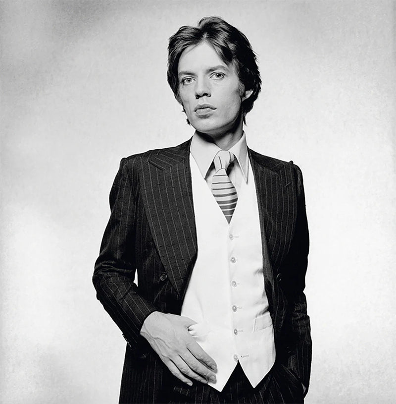 Terry O'Neill, Rolling Stones singer Mick Jagger dressed in a pinstripe suit, 1976 Limited edition fine art photograph by Terry O'Neill, featuring iconic portrait photography of celebrities and cultural figures. Available for sale at Smolensky Gallery