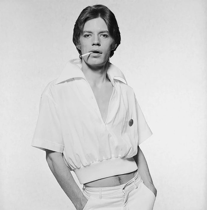 Terry O'Neill, Rolling Stones singer Mick Jagger in a white short-sleeved jacket, circa 1975 Limited edition fine art photograph by Terry O'Neill, featuring iconic portrait photography of celebrities and cultural figures. Available for sale at Smolensky Gallery