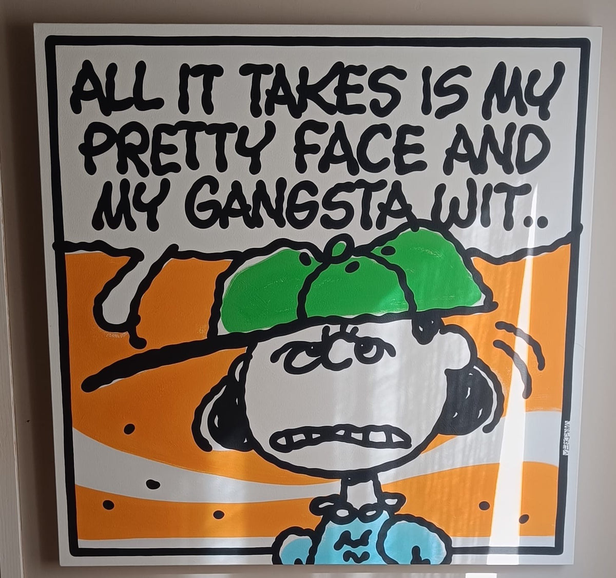 A framed square art print featuring a cartoon character with the text 'ALL IT TAKES IS MY PRETTY FACE AND MY GANGSTA WIT.
