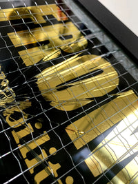 Embrace the art of controlled chaos with Mark Petty's A Glass Act (Gold). This limited edition screen print on reinforced wired glass features a reverse 2-color hand-pulled design with a striking 23.5ct gold gild. Each piece is meticulously smashed, layered up, and framed, creating a unique and unpredictable visual experience. Framed size is 27 x 32 cm. Each artwork comes with a signed plaque, displaying the title on the right side of the frame, and a signed certificate of authenticity on the back.
