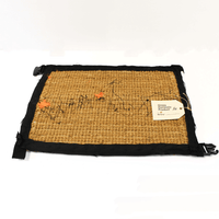 Buy Banksy merchandise online, Banksy for sale, Banksy Welcome Mat 2019, Banksy GDP 2019, Banksy Gross Domestic Product. Image is of a welcome mat, which is brown, stating 'welcome' in cursive writing. The item is distinctively rugged and rustic looking, with zips and safety belt buckles sticking out