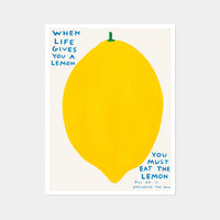An image of an artwork by David Shrigley titled 'When Life Gives You A Lemon'. The piece features a large, cartoon-like depiction of a lemon, with text at the top right stating 'WHEN LIFE GIVES YOU A LEMON', and in the bottom right continuing 'YOU MUST EAT THE LEMON', 'ALL OF IT', 'INCLUDING THE SKIN'. This is a David Shrigley Poster or Print