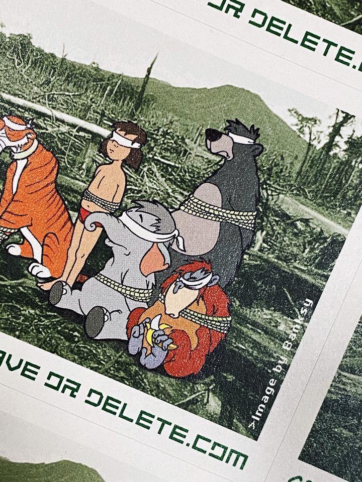 Buy Banksy, Banksy prints for sale, Banksy prints online. Image is of a sticker featuring cartoon animals blindfolded in the midst of a devastated forest. Underneath the image is the Greenpeace logo and the website address 'Saveordelete.com'
