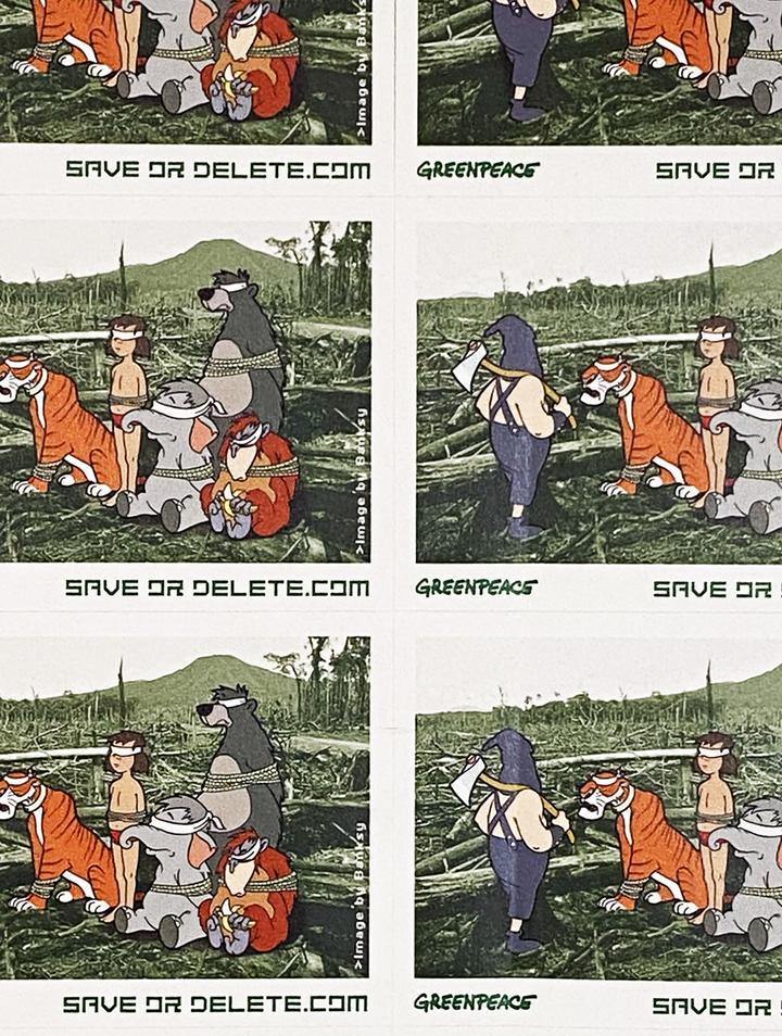 Buy Banksy, Banksy prints for sale, Banksy prints online. Image is of a sticker featuring cartoon animals blindfolded in the midst of a devastated forest. Underneath the image is the Greenpeace logo and the website address 'Saveordelete.com'